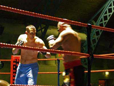 Iain Foss about to stop his opponent in a full contact MMA bout