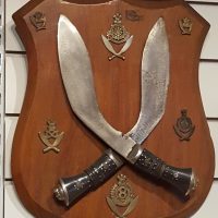 Vintage Indian Kukris and Military Badges. Mounted on a teak wood plaque