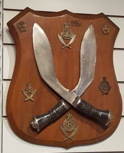 Vintage Indian Kukris and Military Badges. Mounted on a teak wood plaque