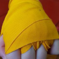 yellow boxing hand wraps.