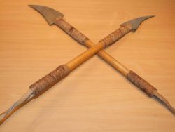 Long hand made Martial arts weapons. The blades of thick Aluminium.  Wooden hafts/ shafts. Bound with leather thongs at each end with wrist straps.  £45.00  the pair .